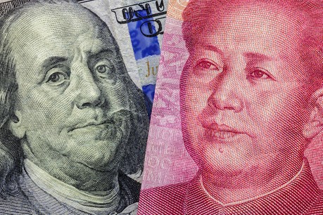 Close up of one hundred Dollar and 100 Yaun banknotes with focus on portraits of Benjamin Franklin and Mao Tse-tung / USA vs China trade war concept. Photo: Lyxor ETF